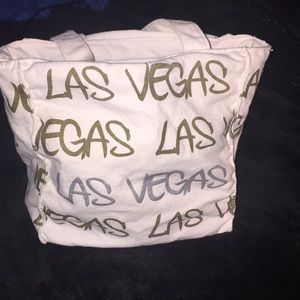 Small White and Gold pocketbook in good condition